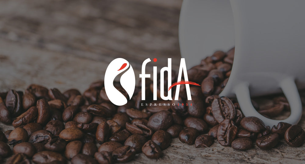 Coffee beans with a white cup and Fida Espresso logo in the background